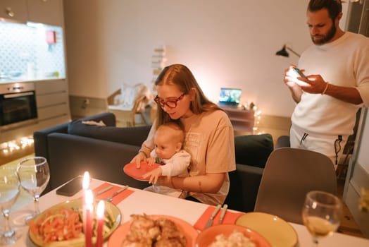 A heartwarming family dinner featuring a joyful baby, a cozy ambiance, and unforgettable memorable moments