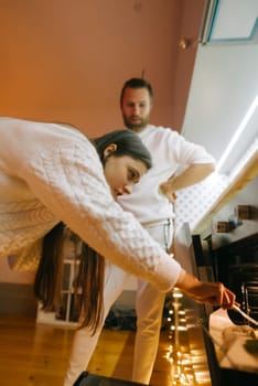 A couple is engaging in the process of creating a warm and inviting setting filled with thoughtful details