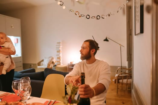 A warm moment of celebration with family, capturing laughter and connections shared over cozy drinks