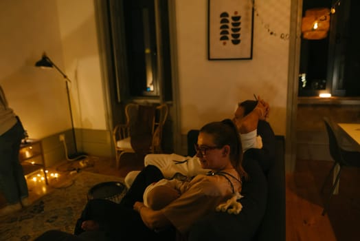 A warm and intimate moment encapsulating a beautiful family evening with their newborn in a cozy, modern living space