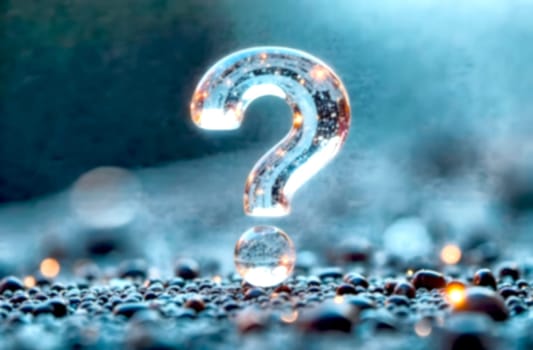 A crystal clear question mark stands tall on a bed of small water droplets, symbolizing uncertainty and the pursuit of solutions.. Blurred picture