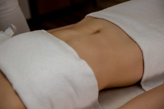 A tranquil spa scene with a patient enjoying a soothing treatment that promotes relaxation and rejuvenation