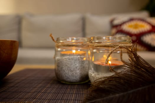 This serene setup features beautifully lit candles, elegant decorative items, and an overall tranquil atmosphere
