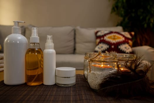 A beautifully arranged and serene display of various spa products and elegant candles for a calming home experience