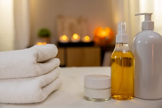 A tranquil and relaxing spa setting adorned with fluffy towels and soothing essential oils promoting wellness