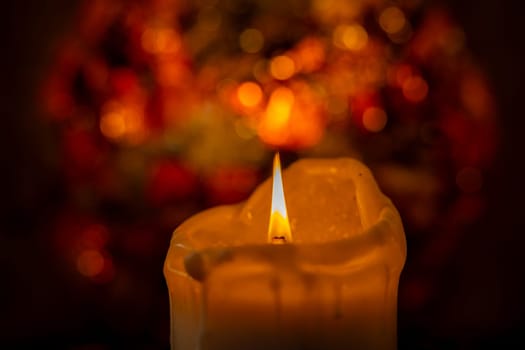 A tranquil and serene candle flame gracefully reflecting warmth amidst a softly blurred and dreamy background