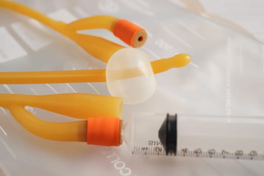 Foley catheter and urine drainage bag collect urine for disability or patient in hospital.