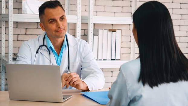 Doctor in professional uniform examining patient at hospital or medical clinic. Health care , medical and doctor staff service concept. Jivy