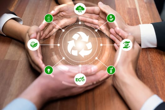 Business partnership form circular hand together around recycle icon symbolize ESG sustainable environment and ecosystem protection with eco recycling technology and waste reduction. Reliance