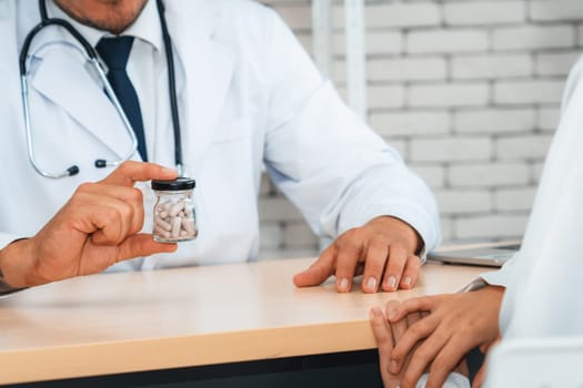 Doctor in professional uniform examining patient at hospital or medical clinic. Health care , medical and doctor staff service concept. Jivy