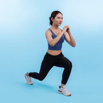 Young attractive asian woman in sportswear stretching before fitness exercise routine. Healthy body care workout with athletic woman warming up on studio shot isolated background. Vigorous