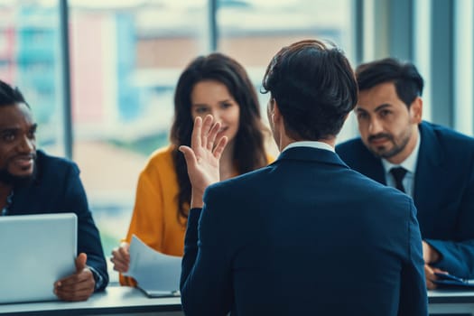 Diversity recruiters interview candidate at the bright office. A group of human resources professionals explaining an applicant for a new position. asking interviewee a question. Intellectual.