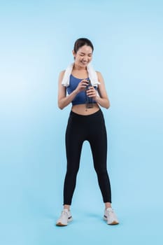 Athletic and sporty asian woman resting and drink water after intensive cardio workout training. Healthy exercising and fit body care lifestyle pursuit in studio shot isolated background. Vigorous