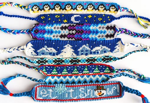 Woven DIY friendship bracelets handmade of embroidery floss with knots in blue style
