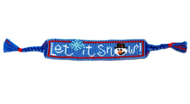 Woven friendship bracelet with Christmas alpha pattern Let it snow. Handmade of thread, isolated on white background. New Year DIY gift idea