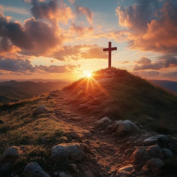 A wooden cross on a hilltop illuminated by a glowing sunrise, with rugged terrain and a colorful, dramatic sky in the background.