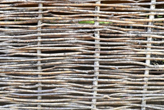Wooden fence made of rods in a japanese garden