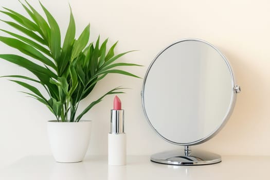 A sleek makeup setup featuring a round mirror, lush green plant, and a stylish lipstick. Perfect for beauty, self-care, and minimalist decor inspiration.