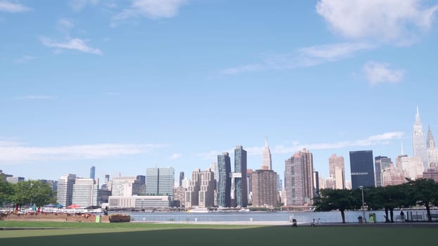 New York City, United States - 30 Aug 2023: Waterfront skyline, Manhattan Midtown buildings, riverfront skyscrapers, East river water. Waterside cityscape view from Hunters Point, Long Island, Queens.