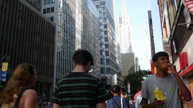 New York City, United States - 4 Sept 2023: Manhattan Midtown, Fifth 5 avenue, 42 street intersection near Bryant Park, Library, Grand Central. American people, McDonalds fast food. Chrysler building.