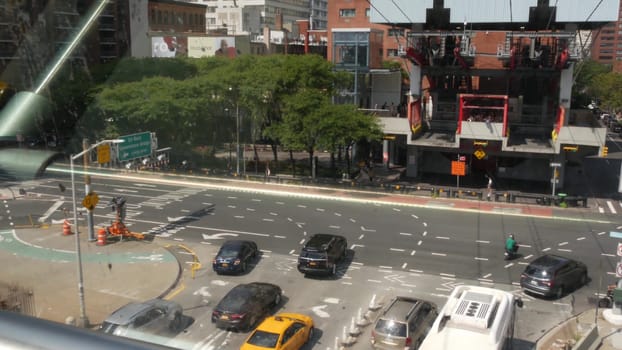 New York City, United States - 4 Sept 2023: Roosevelt Island tramway, Manhattan Midtown street. American cable tram, Queensboro Bridge. Urban public transport in USA. Architecture and avenue traffic.