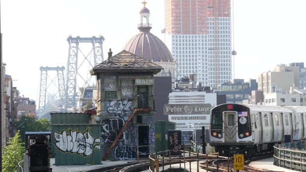 New York City, United States - 7 Sept 2023: Subway station. Metro train, public transportation platform. Elevated outdoor NYC railway Marcy Av, Brooklyn passenger railroad traffic, Williamsburg Bridge