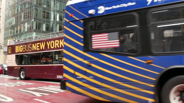 New York City, United States - 4 Sept 2023: Manhattan Midtown, Fifth 5 avenue 42 street intersection corner near Bryant Park, Library, Grand Central. American people, Big Bus tours double-decker, Flag