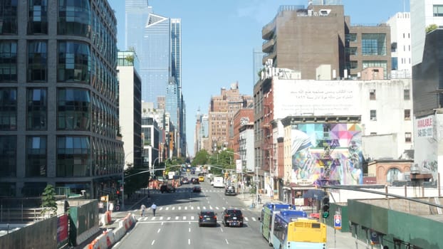 New York City, United States - 1 Sept 2023: Hudson Yards urban architecture, High Line, Chelsea, Manhattan Midtown street, 10 avenue. Car road traffic. Graffiti mural, Mother Teresa and Mahatma Gandhi