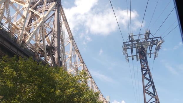 New York City, United States - 12 Sept 2023: Roosevelt Island tramway to Manhattan Midtown. American aerial cable tram near Queensboro Bridge. Urban public transportation, passenger transport in USA.