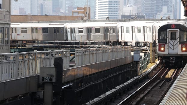 New York City, United States - 2 September 2023: Subway station. Metro train on public transportation platform. Elevated Queensboro Plaza railway, Queens. NYC passenger railroad traffic, Long Island.
