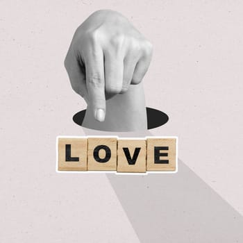 A human hand showing a text of love on wooden cubes on a colored background. Concept of Valentine Day. Collage art