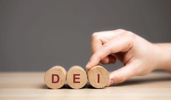 Wooden blocks with the word DEI - Diversity equity inclusion. Values held by many organizations that are working to be supportive of different groups of individuals
