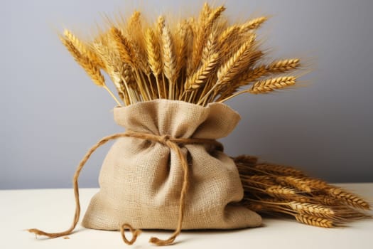 Sack of wheat and ears of wheat on a grey background. Quality products, healthy eating. Generated by artificial intelligence