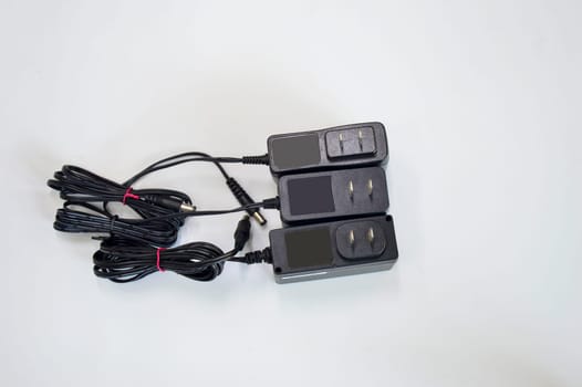 DC adapter in black on white background