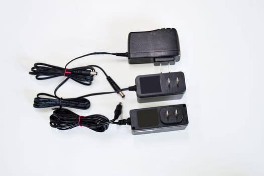 DC adapter in black on white background
