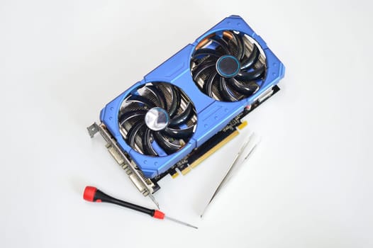 blue graphics card placed on a white background