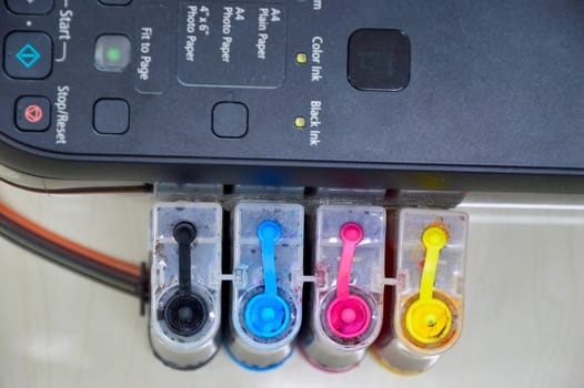 Top view of the printer's ink cartridge, available in 4 colors.