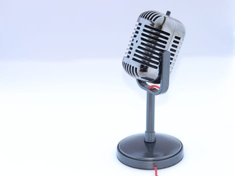 Retro style microphone on a white background.                               
