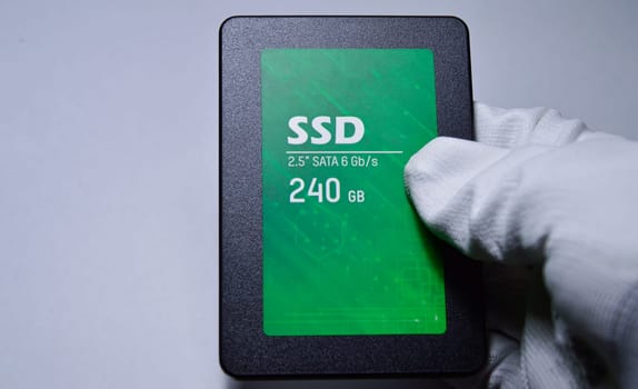 Close-up photo of 2.5" SSD hard drive, empty on white background.