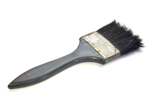 Image of paint brush, old condition, on a white background.