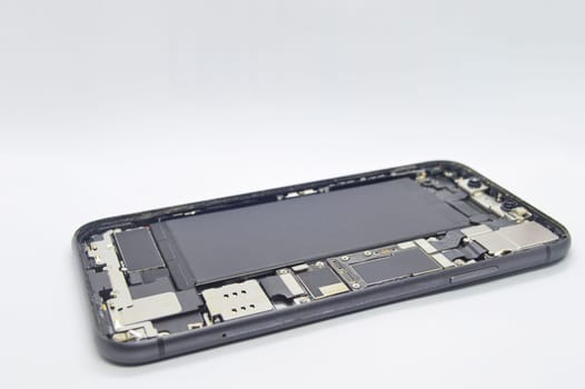 Close-up side view of an open cell phone (mobile phone repair)