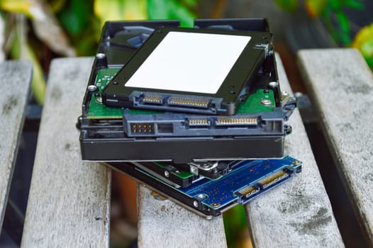 ssd hard drive stacked on wooden floor