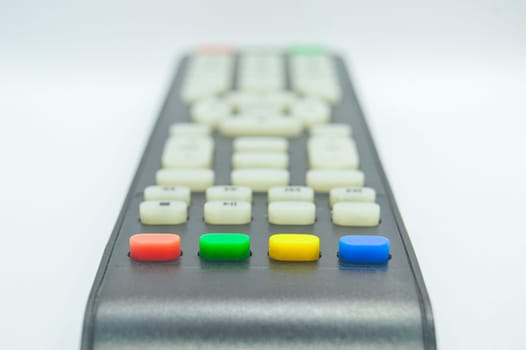 The bottom view of the remote control has four colored buttons.