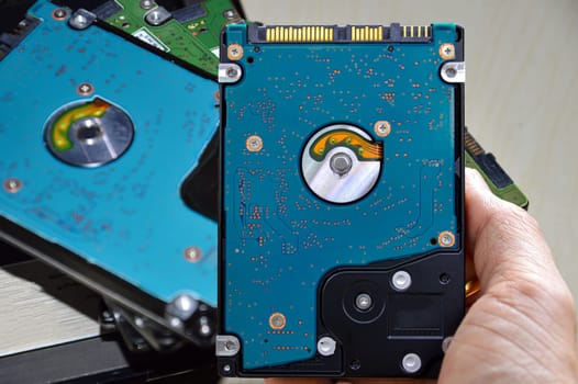 Hard disk drives are still widely used. hard drive in hand