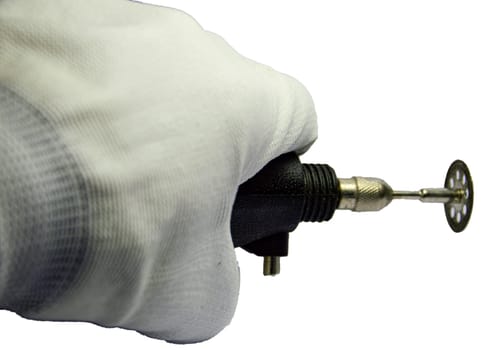 Hand holding a small grinder (with clipping path)