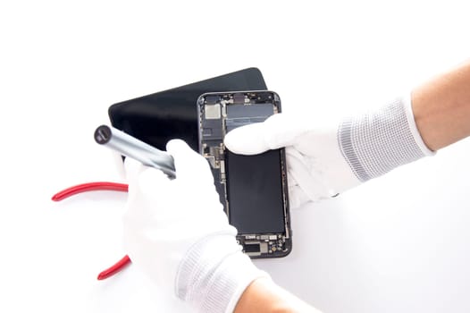 top view, technician fixing a smartphone