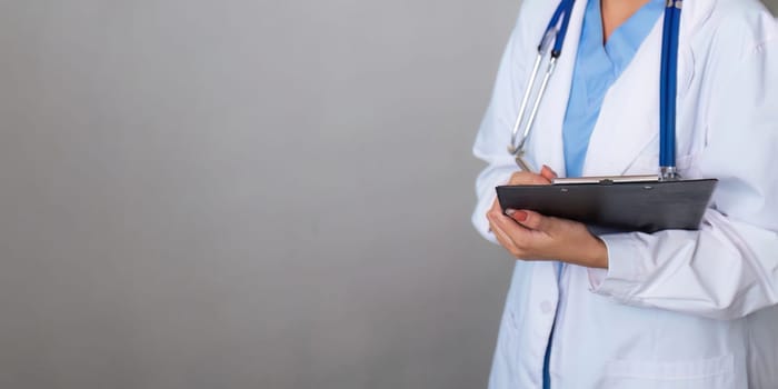 Medical concept of asian beautiful female doctor in white coat with stethoscope, waist up. medical.