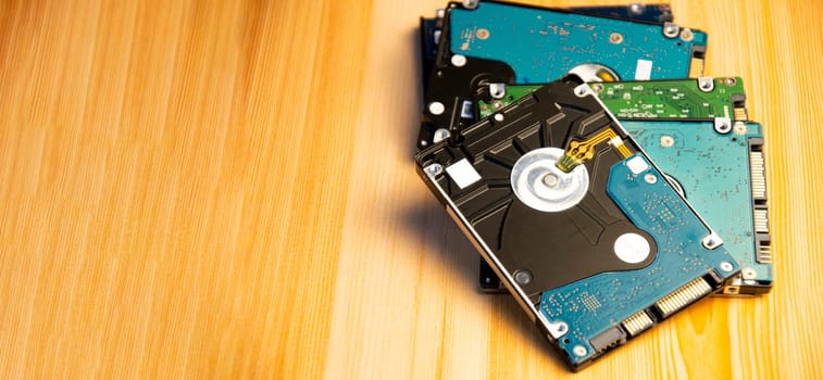 Close-up side view of hard disk on wooden floor