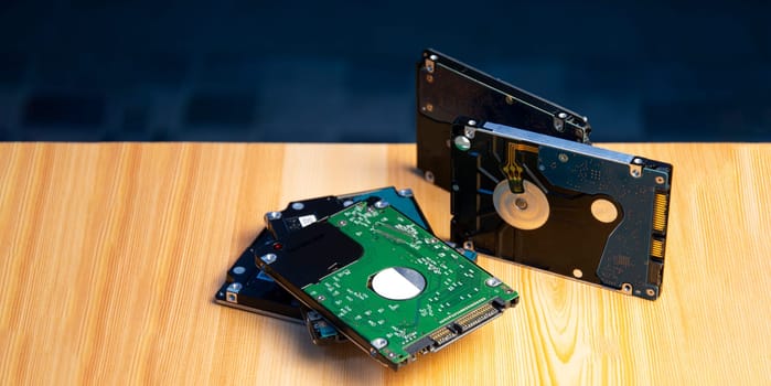 Close-up side view of hard disk on wooden floor