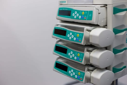 Moscow, Moscow region, Russia - 03.09.2023:Close-up view of medical infusion pumps with display screens and control buttons
